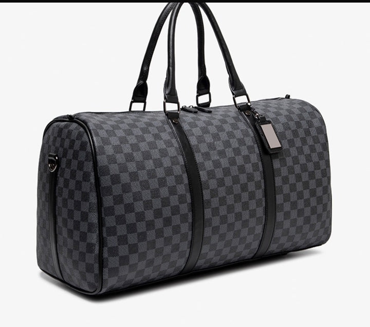 Ezzyrol under seat weekend holdall in a checkerboard pattern, charcoal and grey, three quarter view