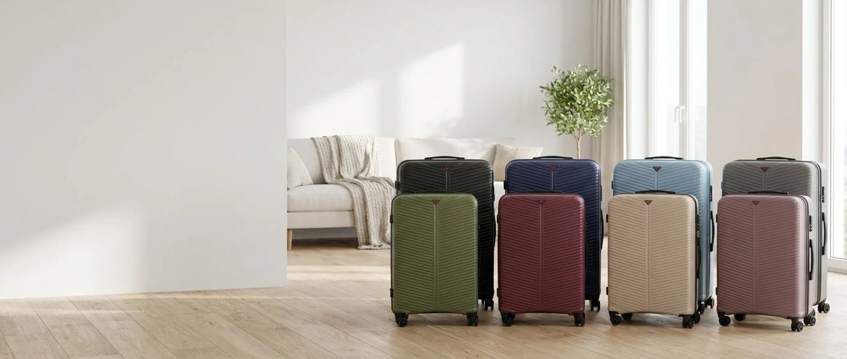 Ribbed hard shell suitcases in eight colours in a bright apartment
