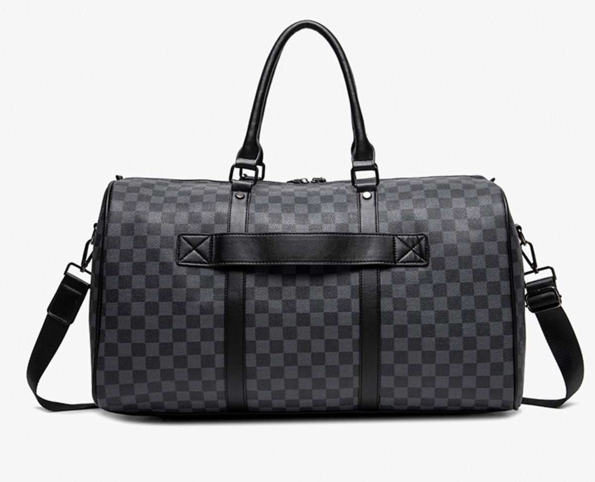 Ezzyrol under seat weekend holdall in a checkerboard pattern, charcoal, front view with the shoulder strap fitted