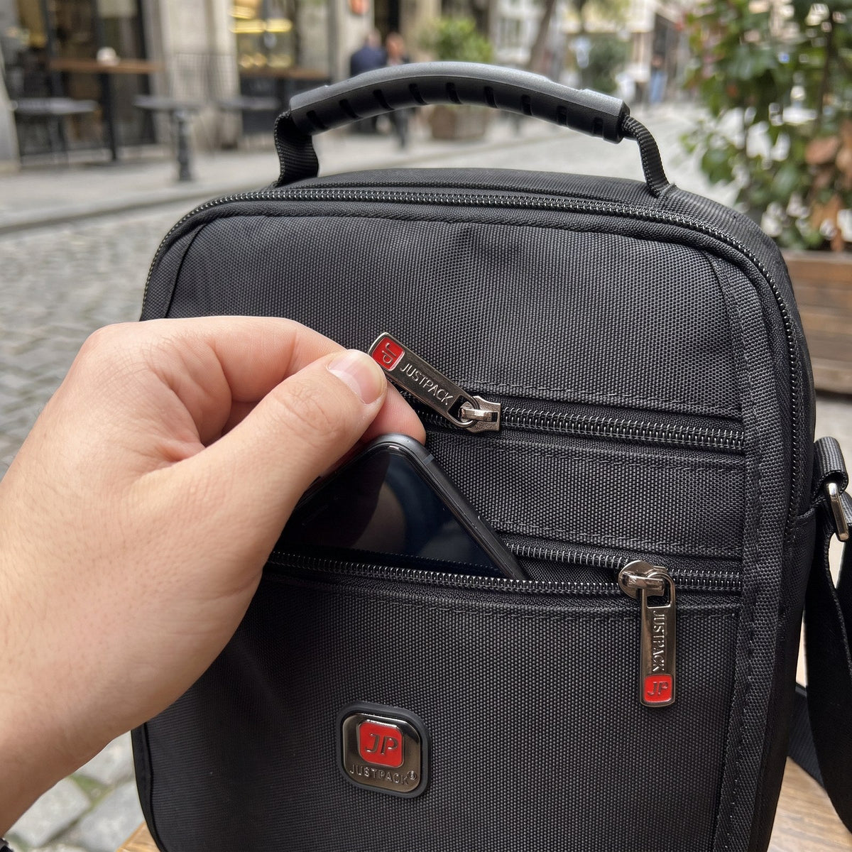 JUSTPACK Runner crossbody, accessing front pocket