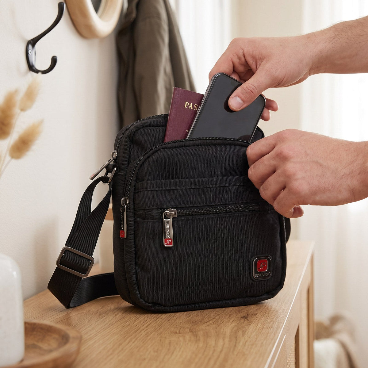 JUSTPACK Courier small crossbody, loading the bag