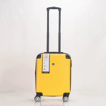 Yellow suitcase with a black handle on a light gray background