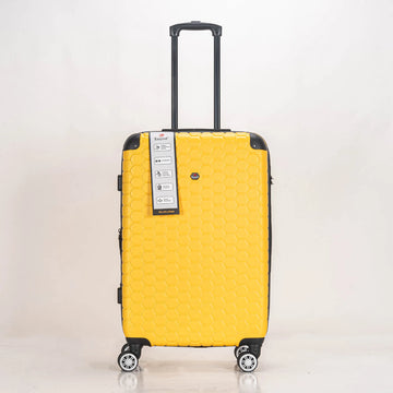 Yellow suitcase with a brand label on a light gray background