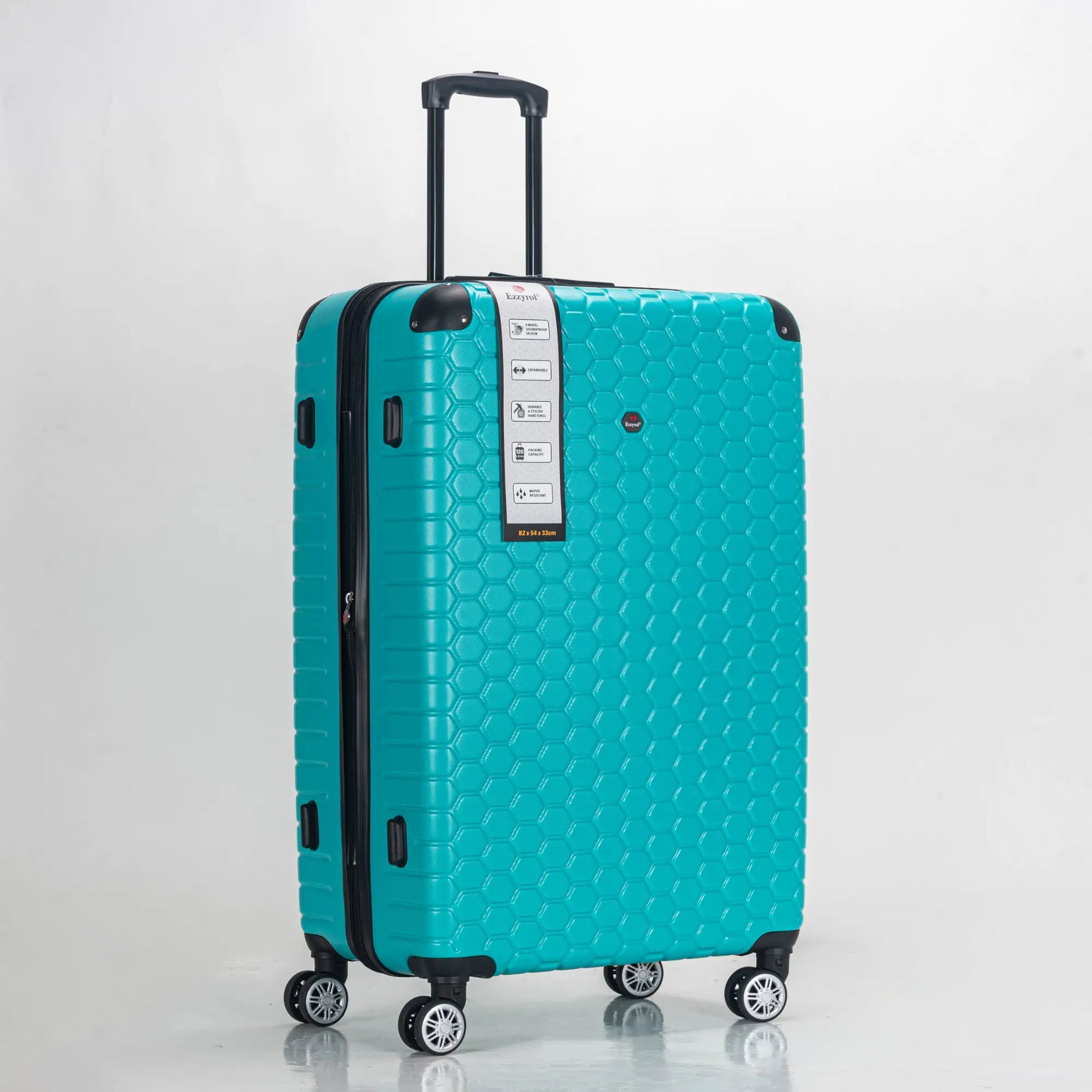 Turquoise suitcase with a honeycomb pattern on a light gray background