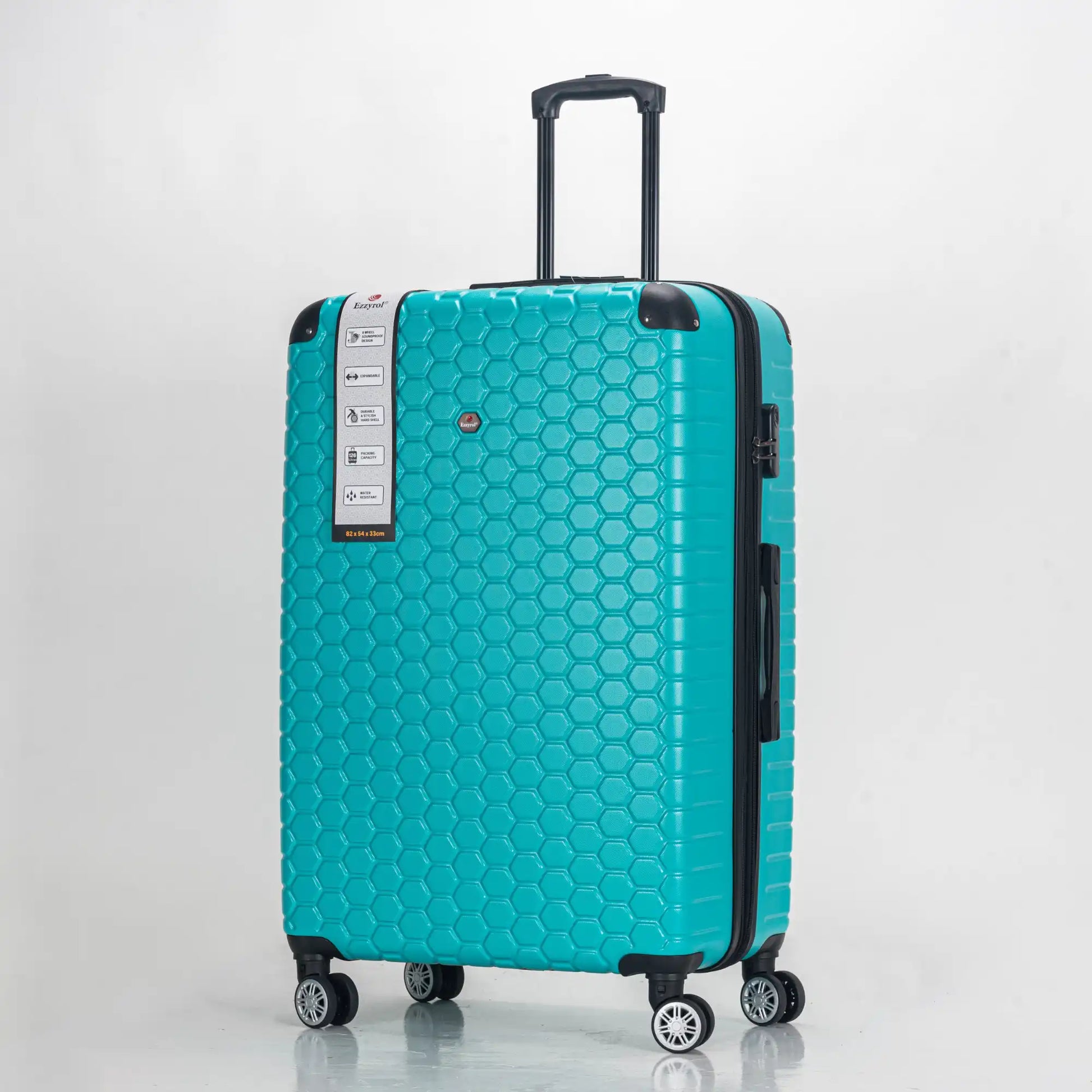 Teal suitcase with honeycomb pattern on a light gray background