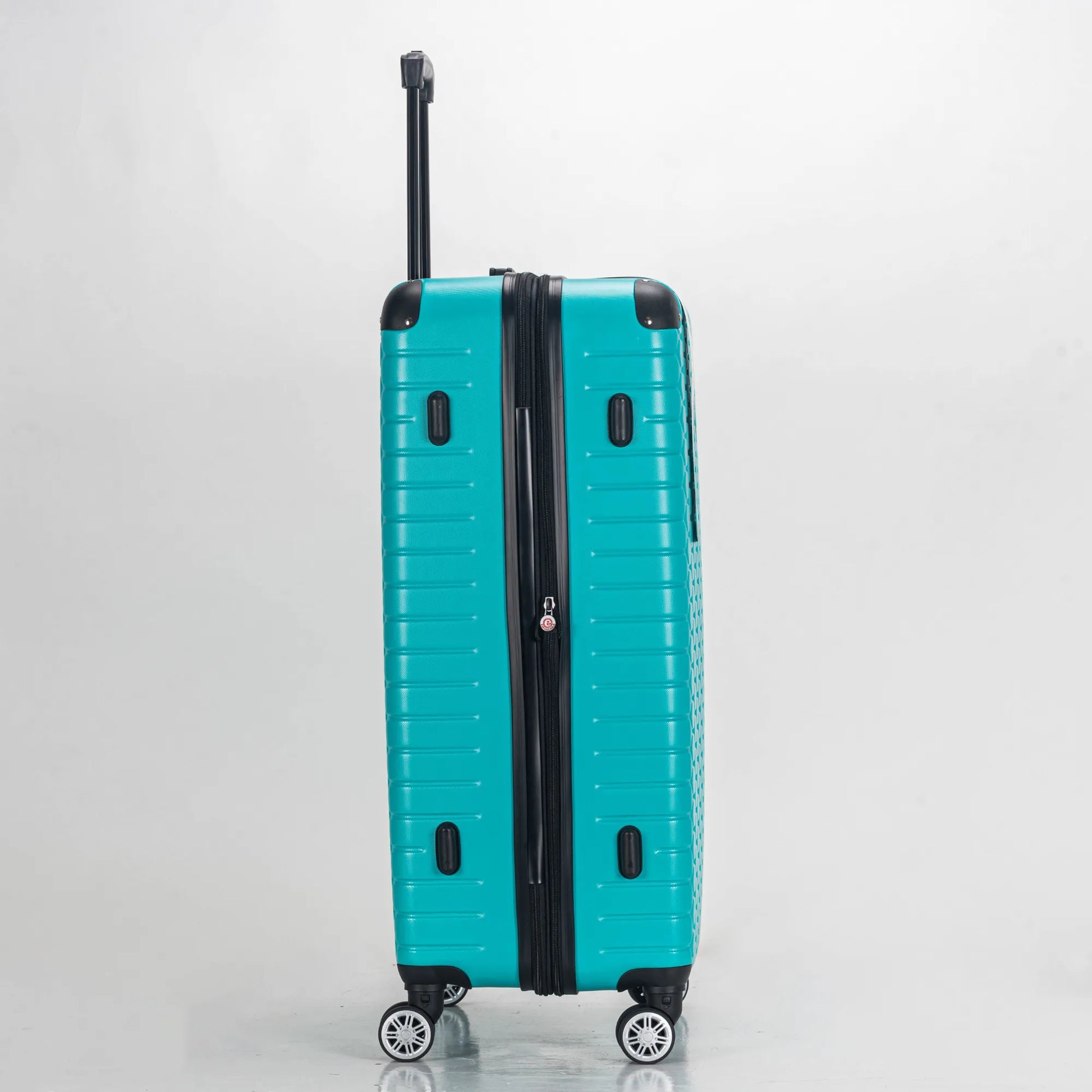 Turquoise suitcase with a black handle on a light gray background