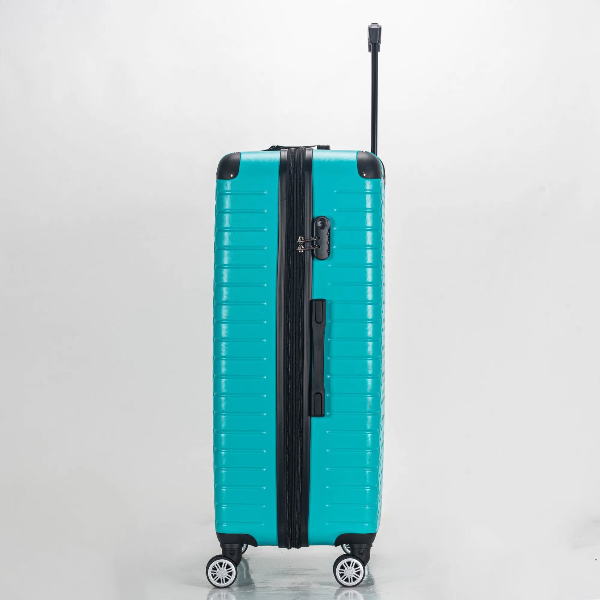 Turquoise suitcase with black handle and wheels on a light gray background