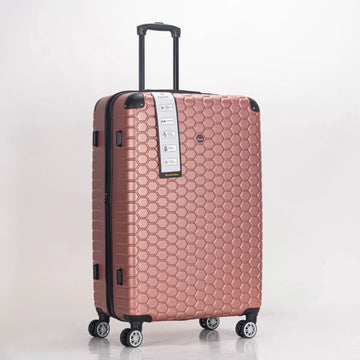 Rose gold suitcase with honeycomb pattern on a white background