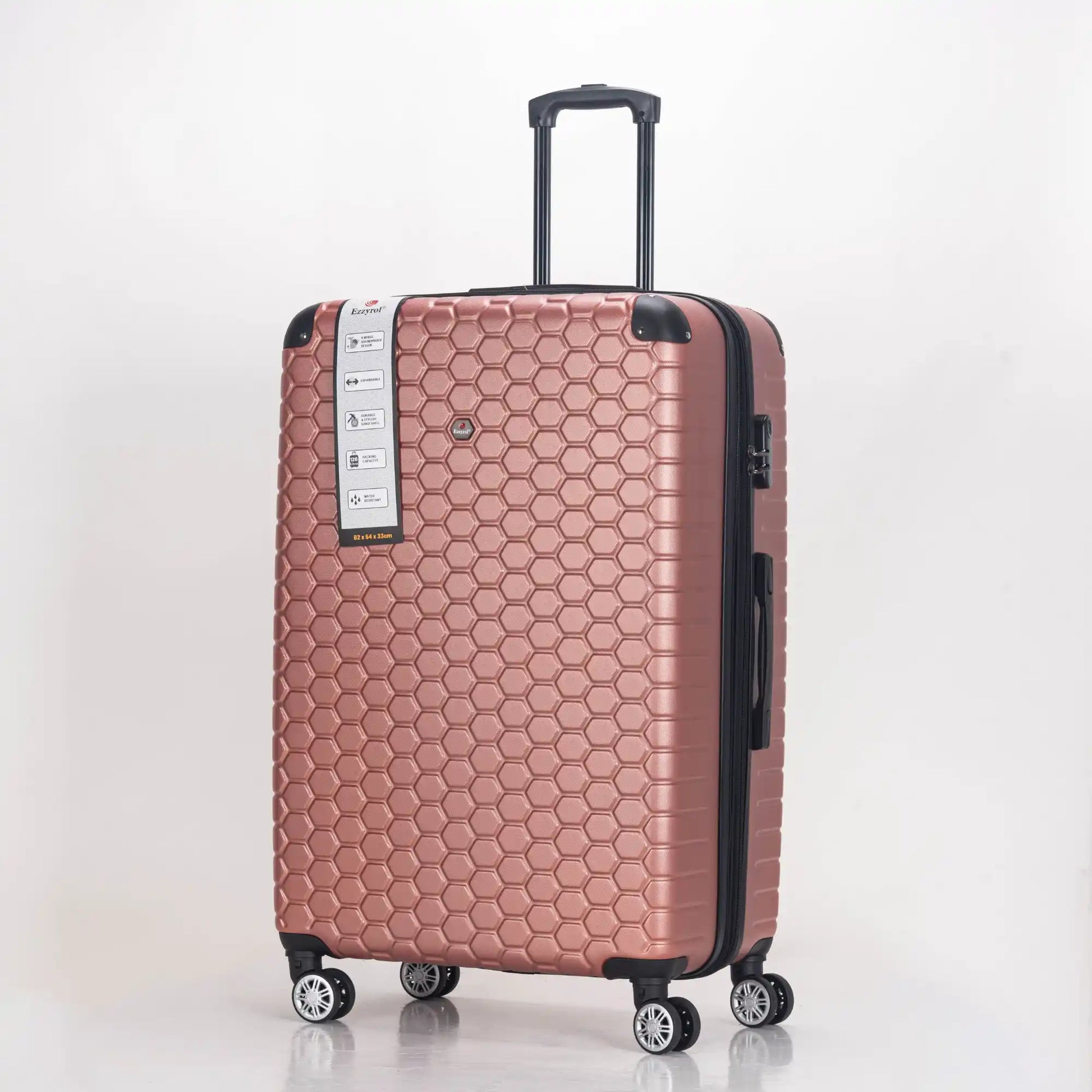 Rose gold suitcase with honeycomb pattern on a white background