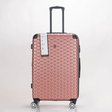 Rose gold suitcase with honeycomb pattern on a white background