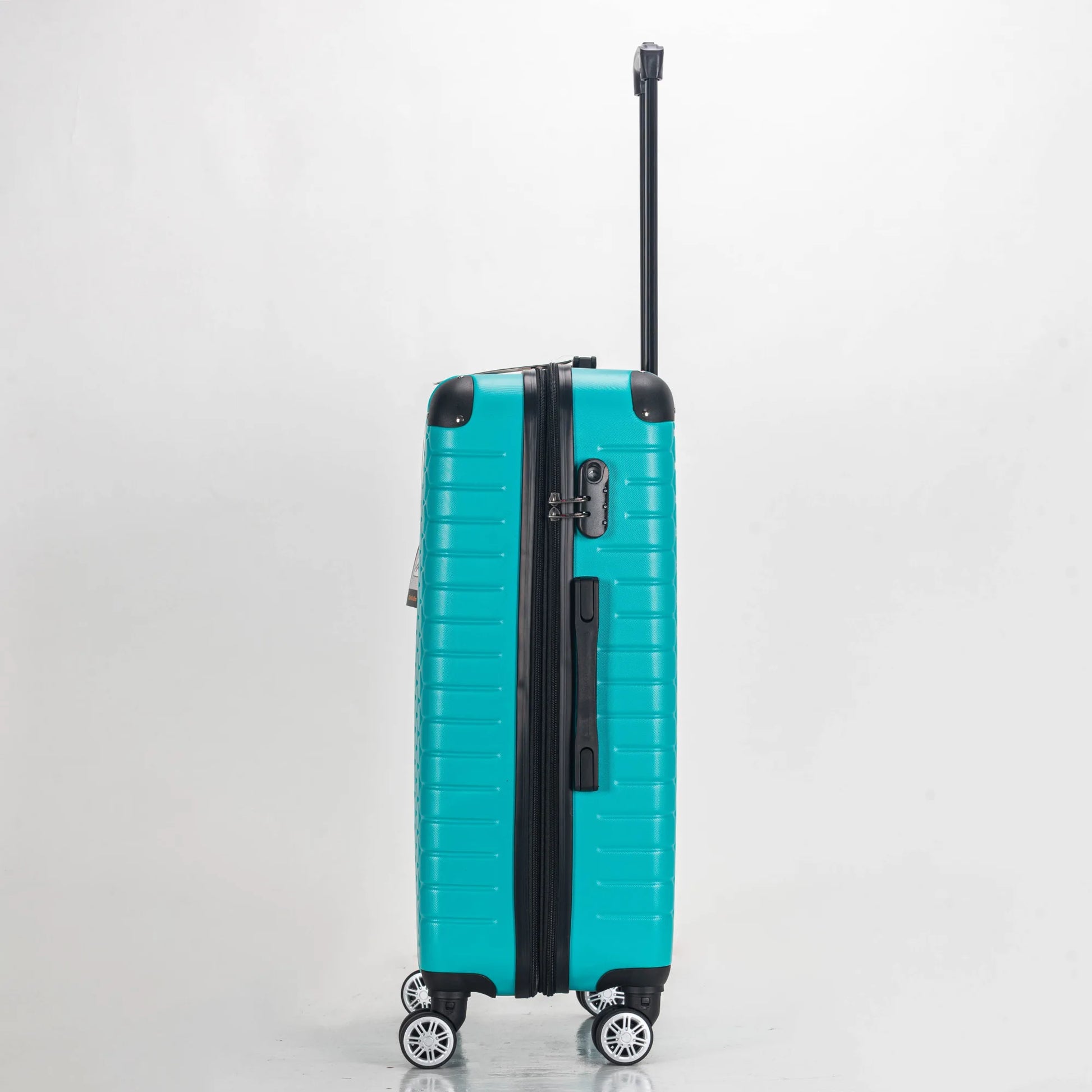 Turquoise suitcase with black accents on a light gray background