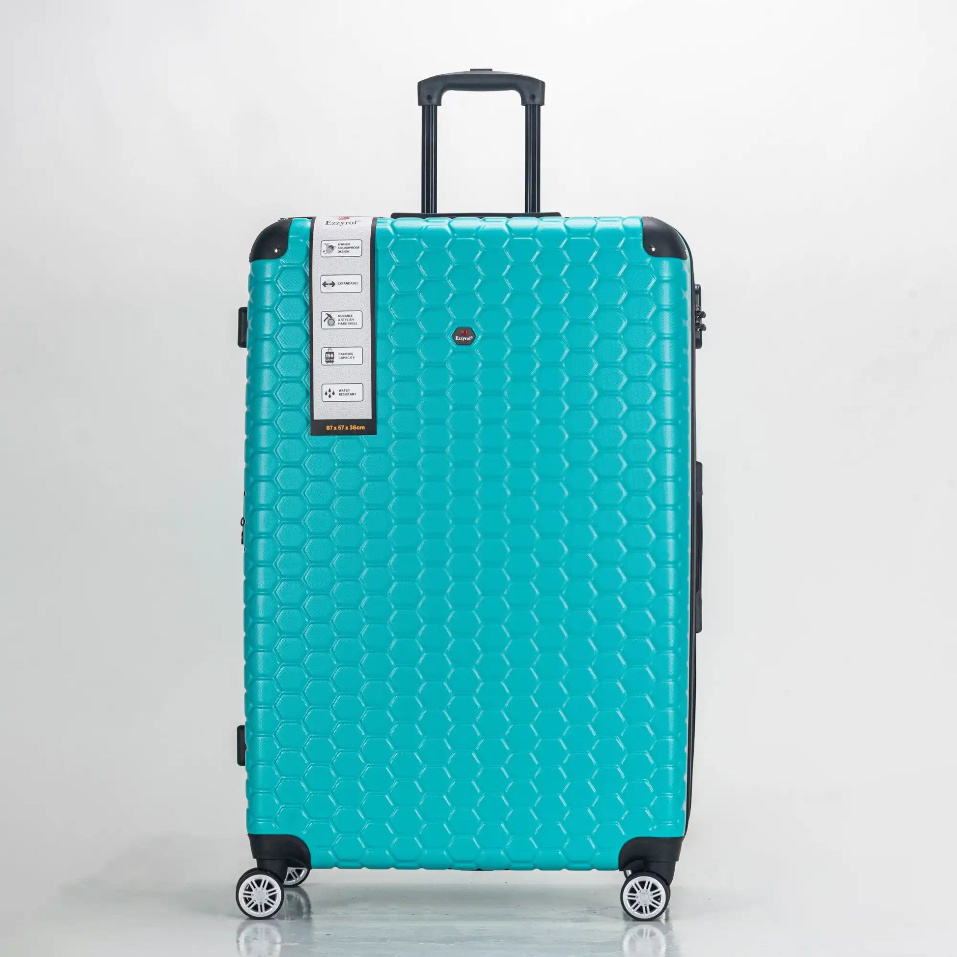 Turquoise suitcase with a honeycomb pattern on a light gray background