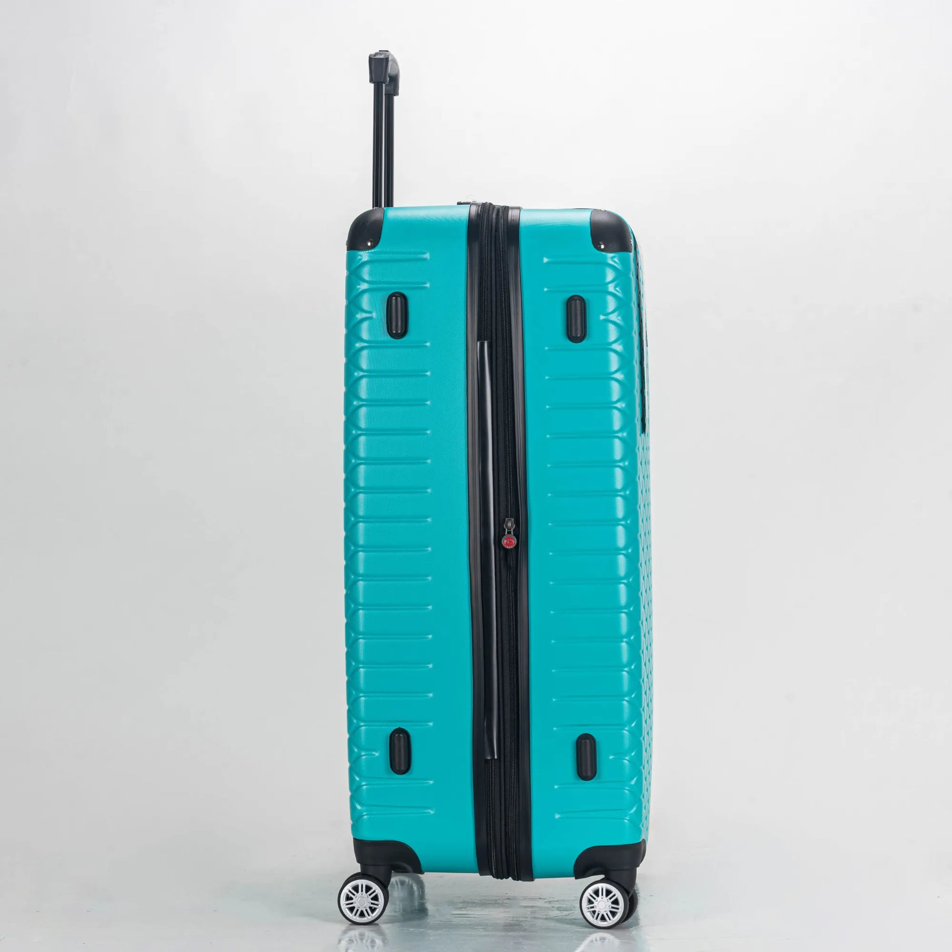 Teal suitcase with black handle and wheels on a light gray background