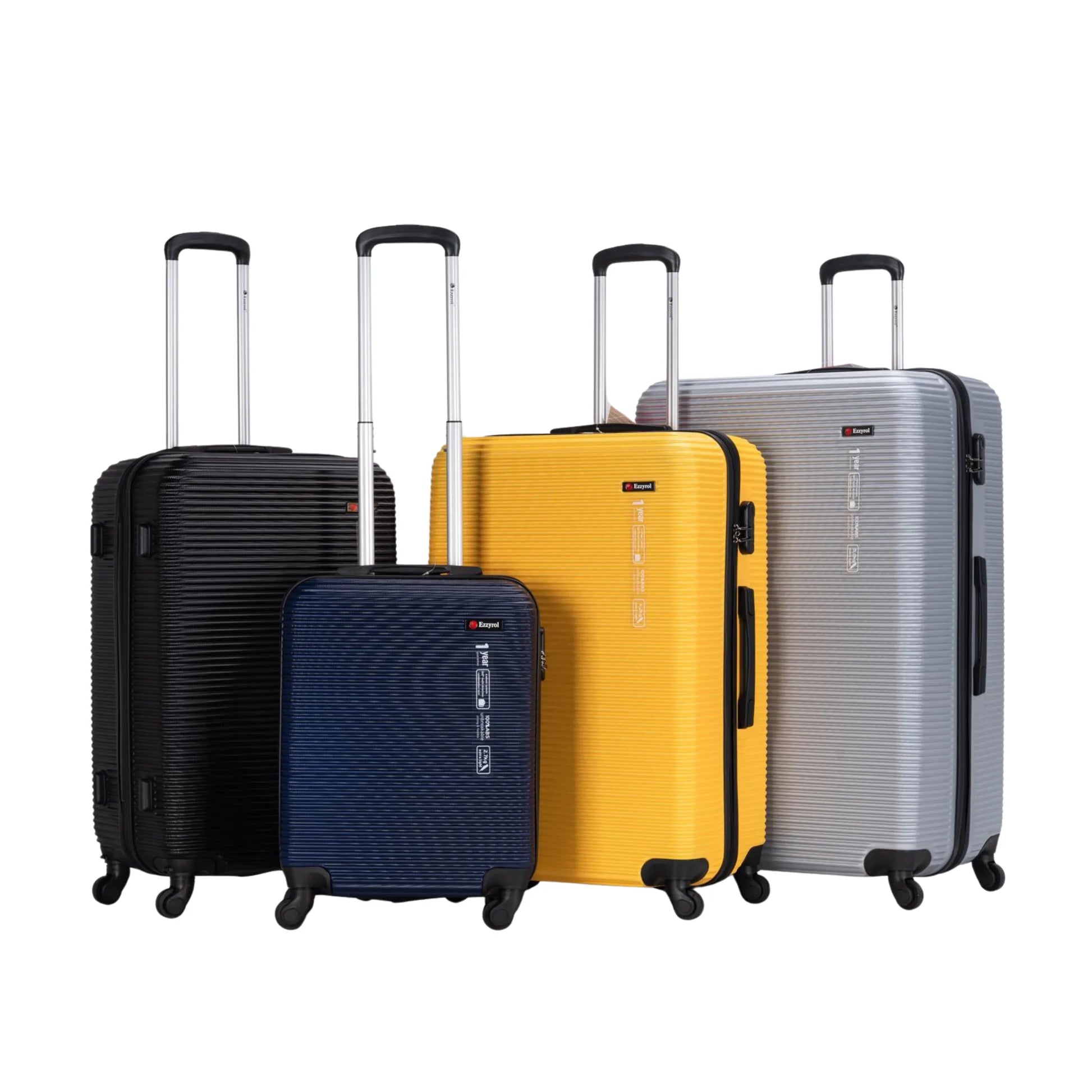 Set of five suitcases in black, blue, yellow, and silver on a white background