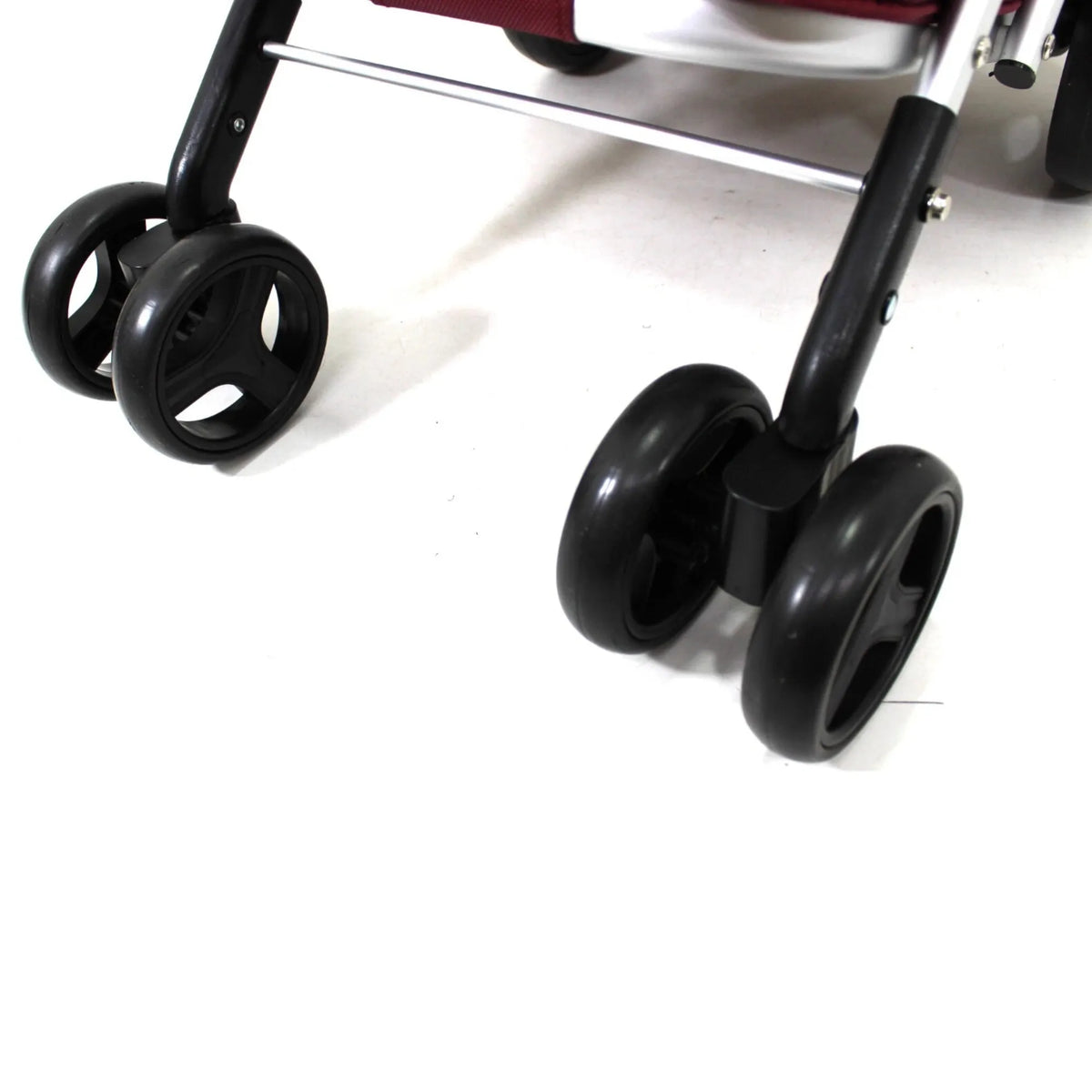 Close-up of a shopping trolley's wheels on a white background