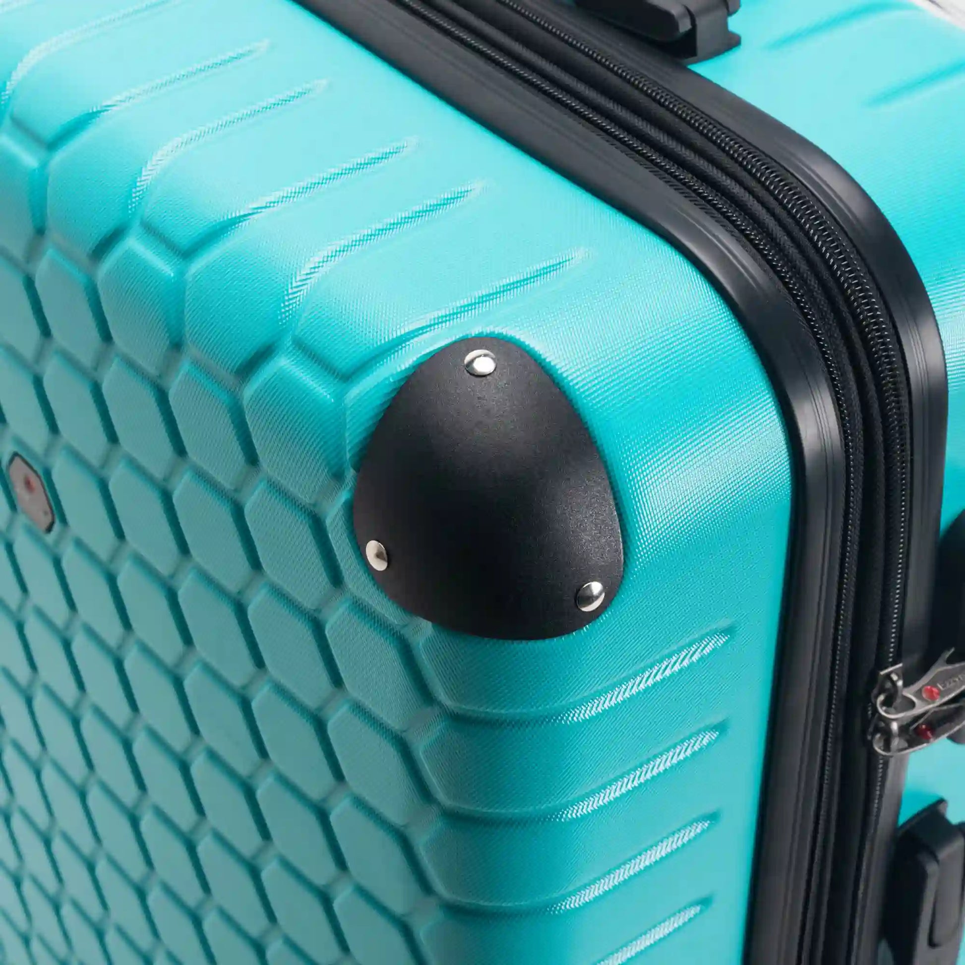 Close-up of a turquoise suitcase with a black handle and wheel.