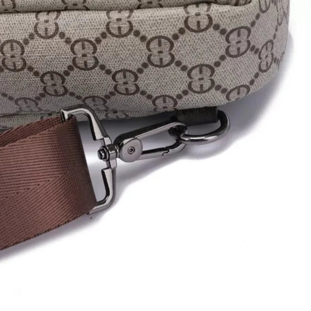 Close-up of a bag strap with a clasp on a light gray background