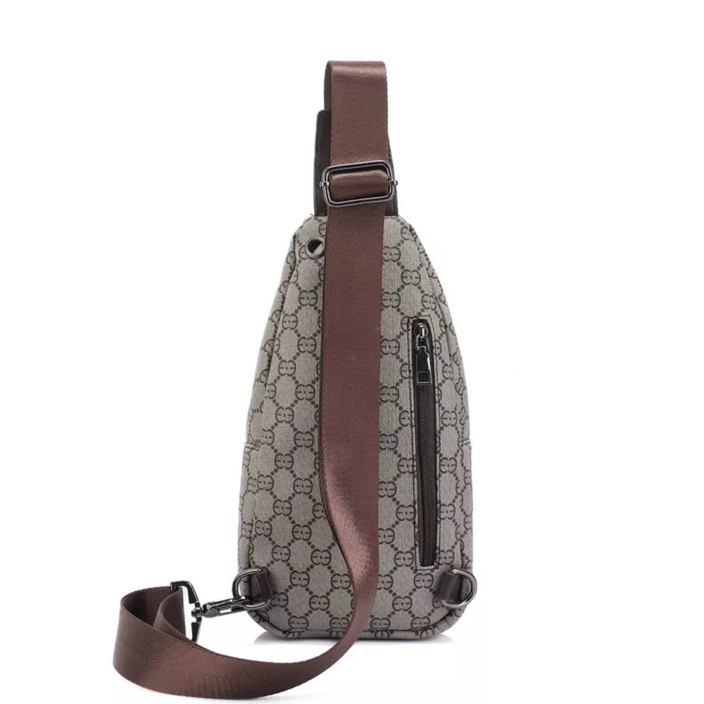 Sling bag with brown strap and patterned body on a white background