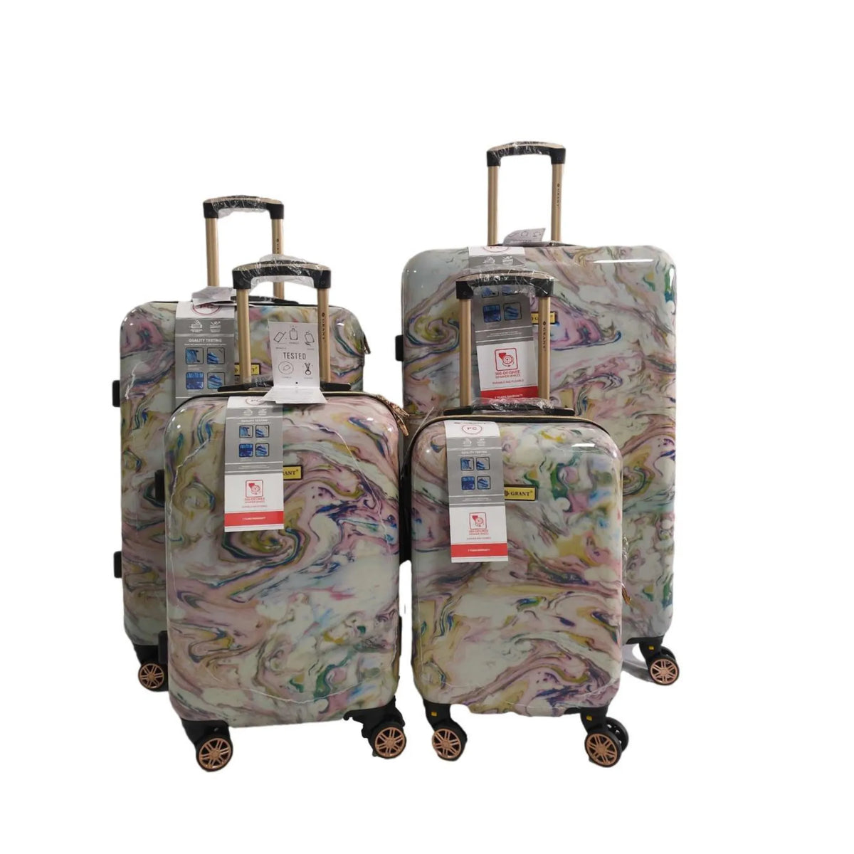 Set of four patterned suitcases on a white background
