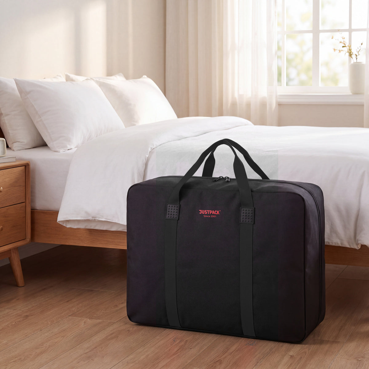 Black Stowaway storing bedding by the bed