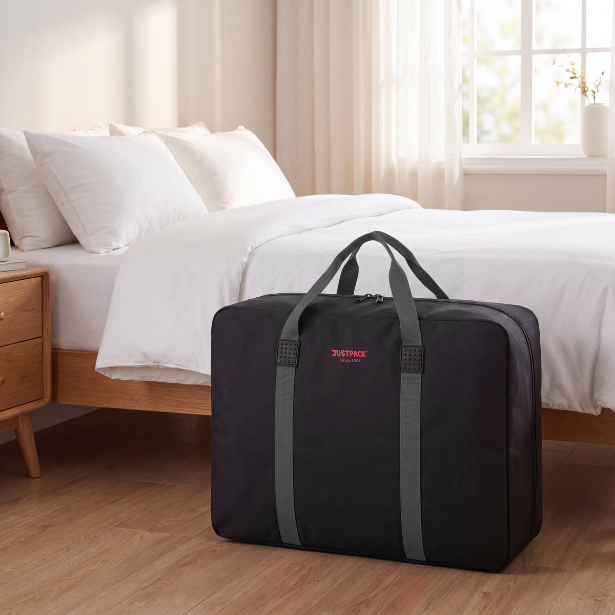 Black with Grey Straps Stowaway storing bedding by the bed