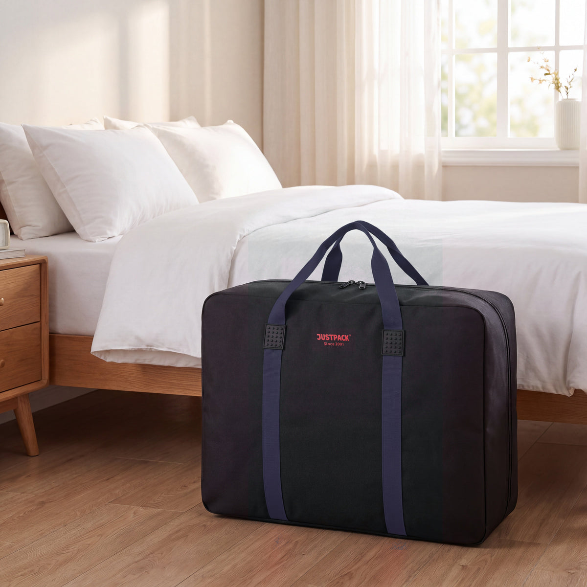 Black with Navy Straps Stowaway storing bedding by the bed