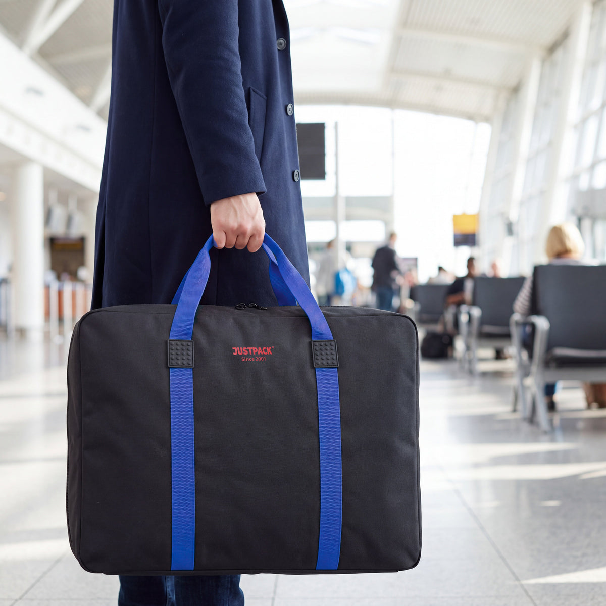 Black with Blue Straps Stowaway carried through an airport