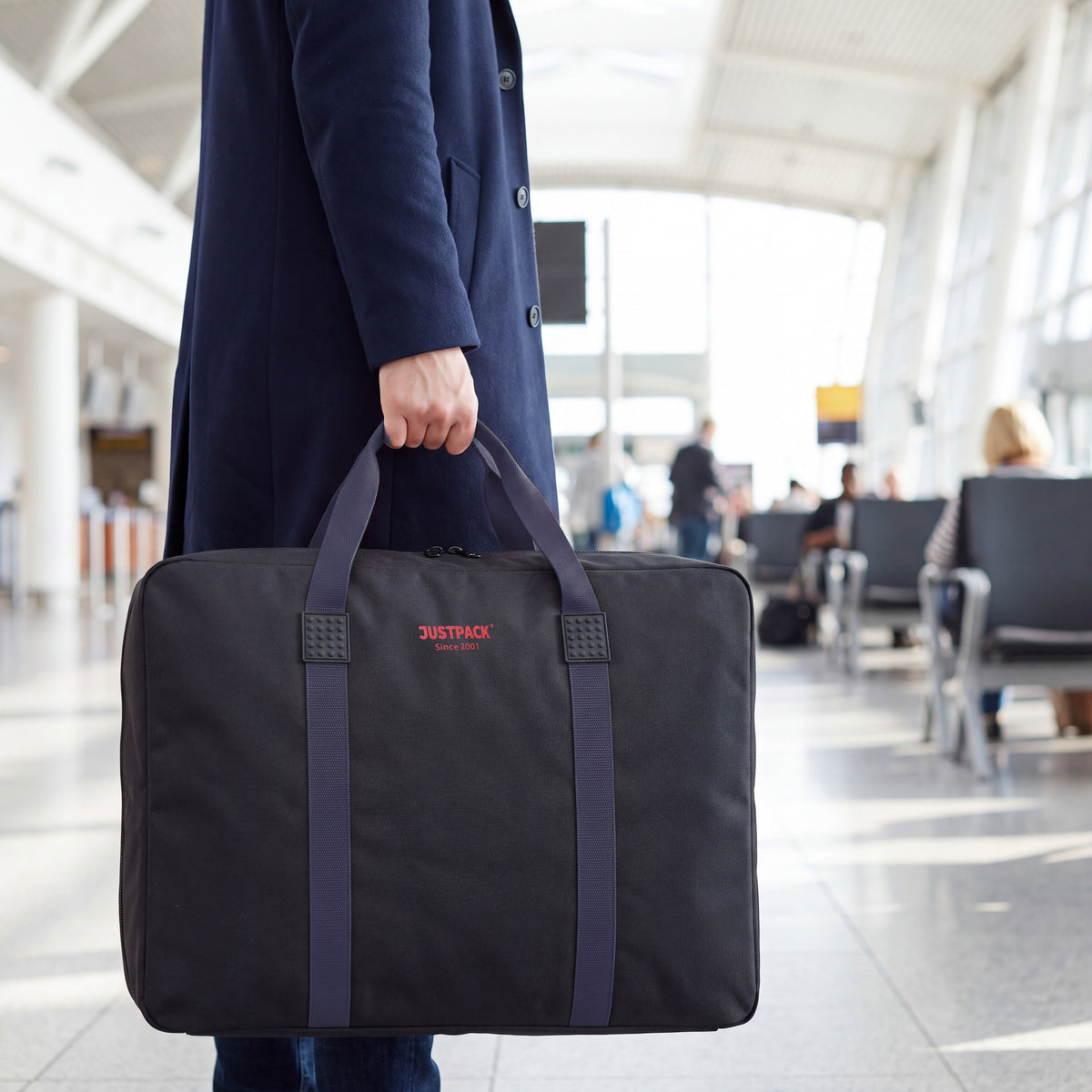 Black with Navy Straps Stowaway carried through an airport