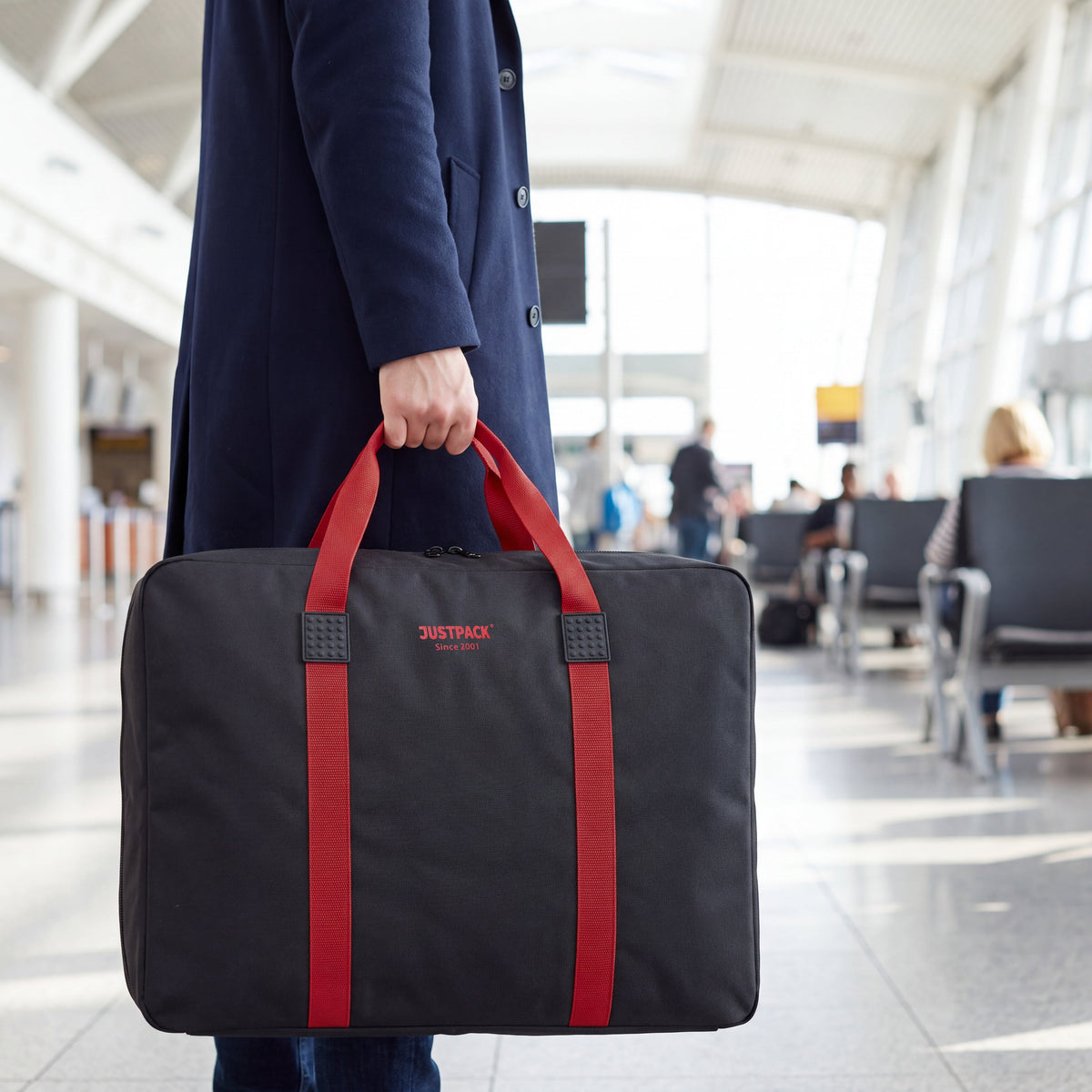 Black with Red Straps Stowaway carried through an airport