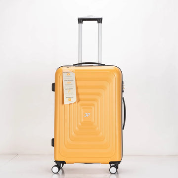Yellow suitcase with a brand tag on a white background