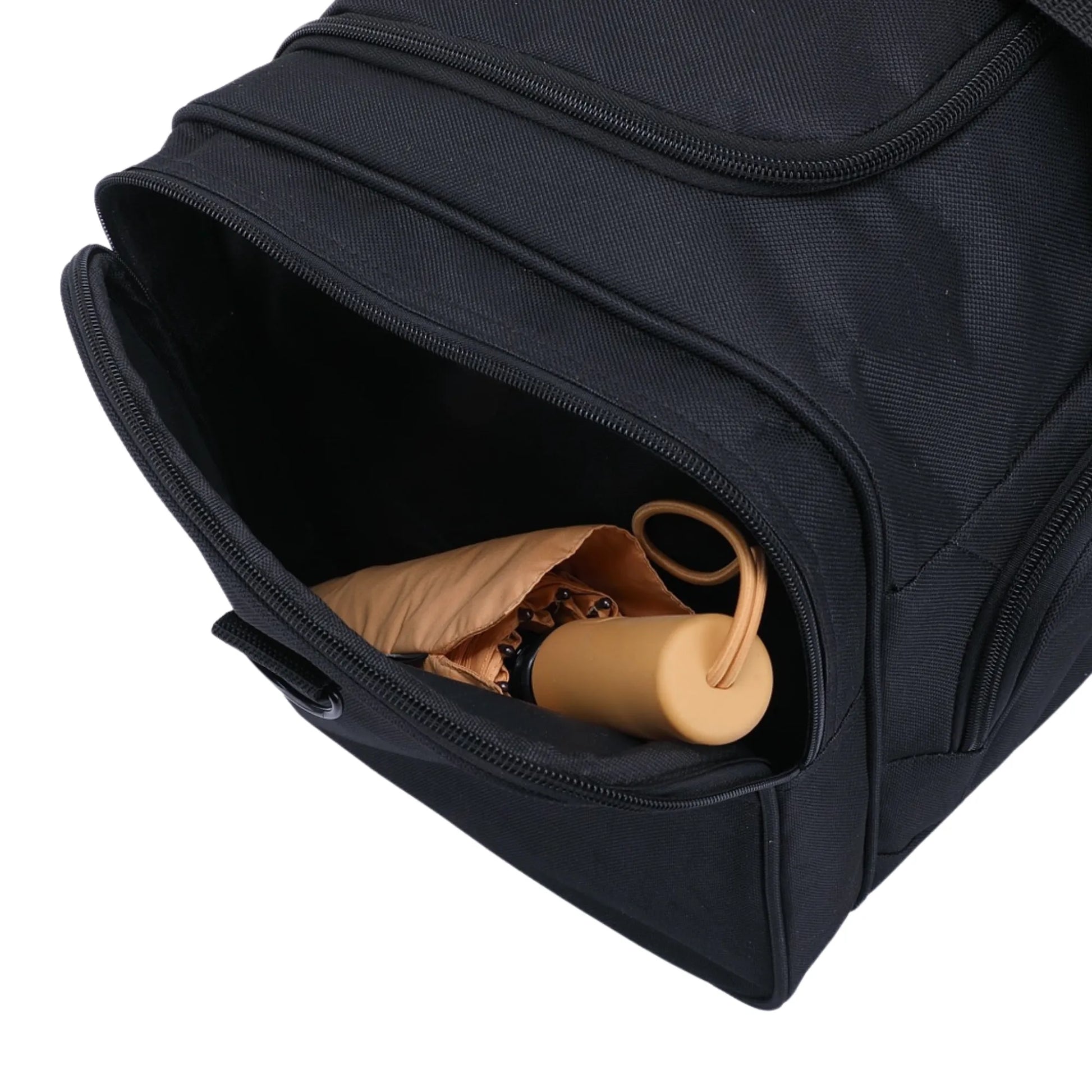 Black backpack with a small compartment containing beige items on a white background