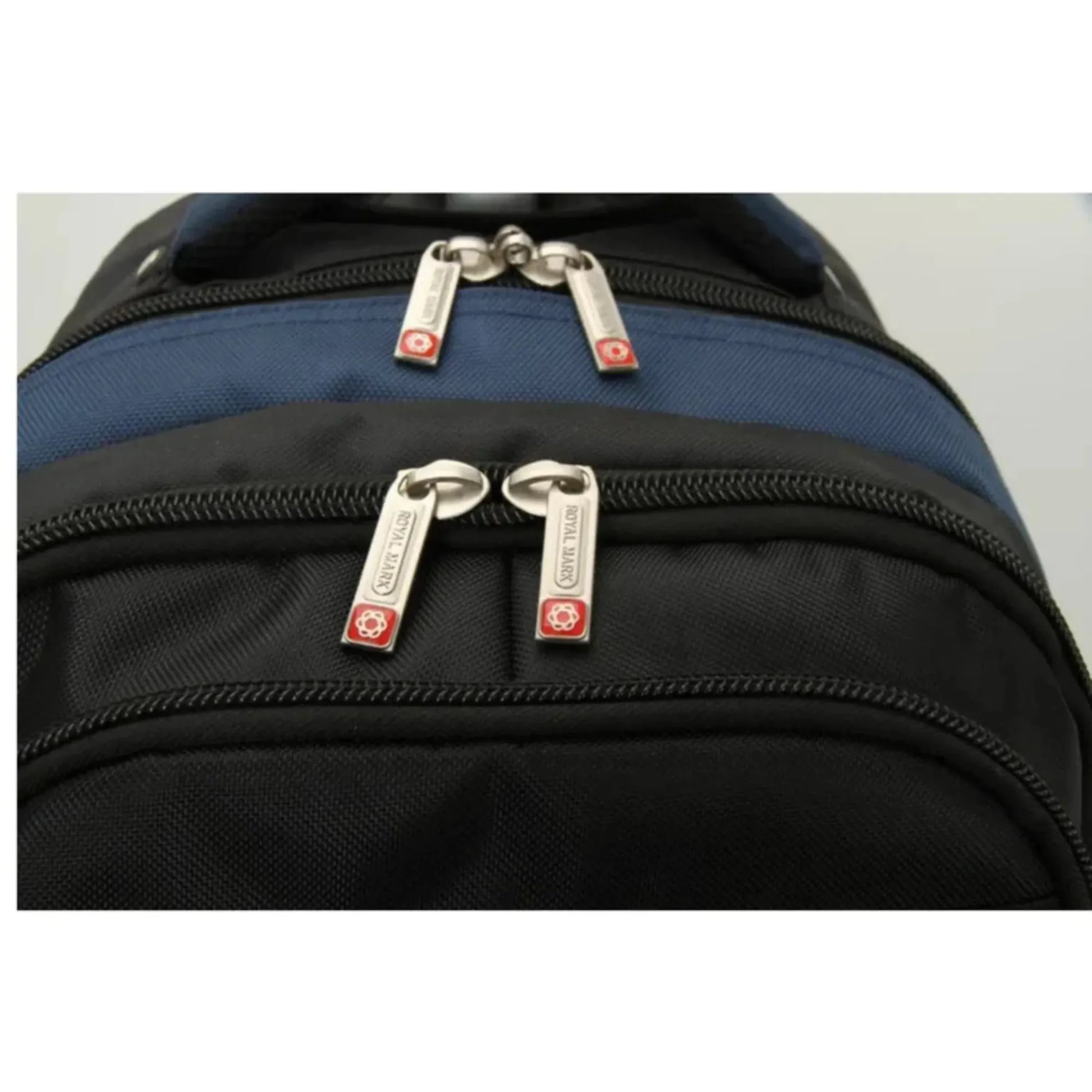 Close-up of a black and blue backpack with zippers and brand logos.