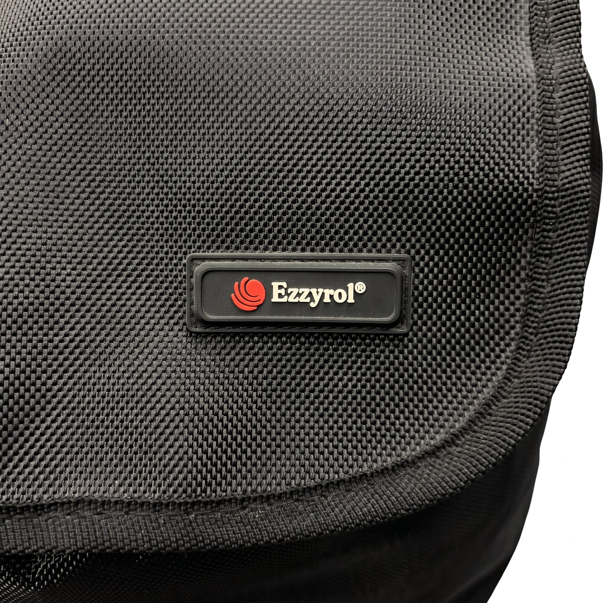 Close-up of the Ezzyrol badge on the mesh pocket of the stair climber trolley