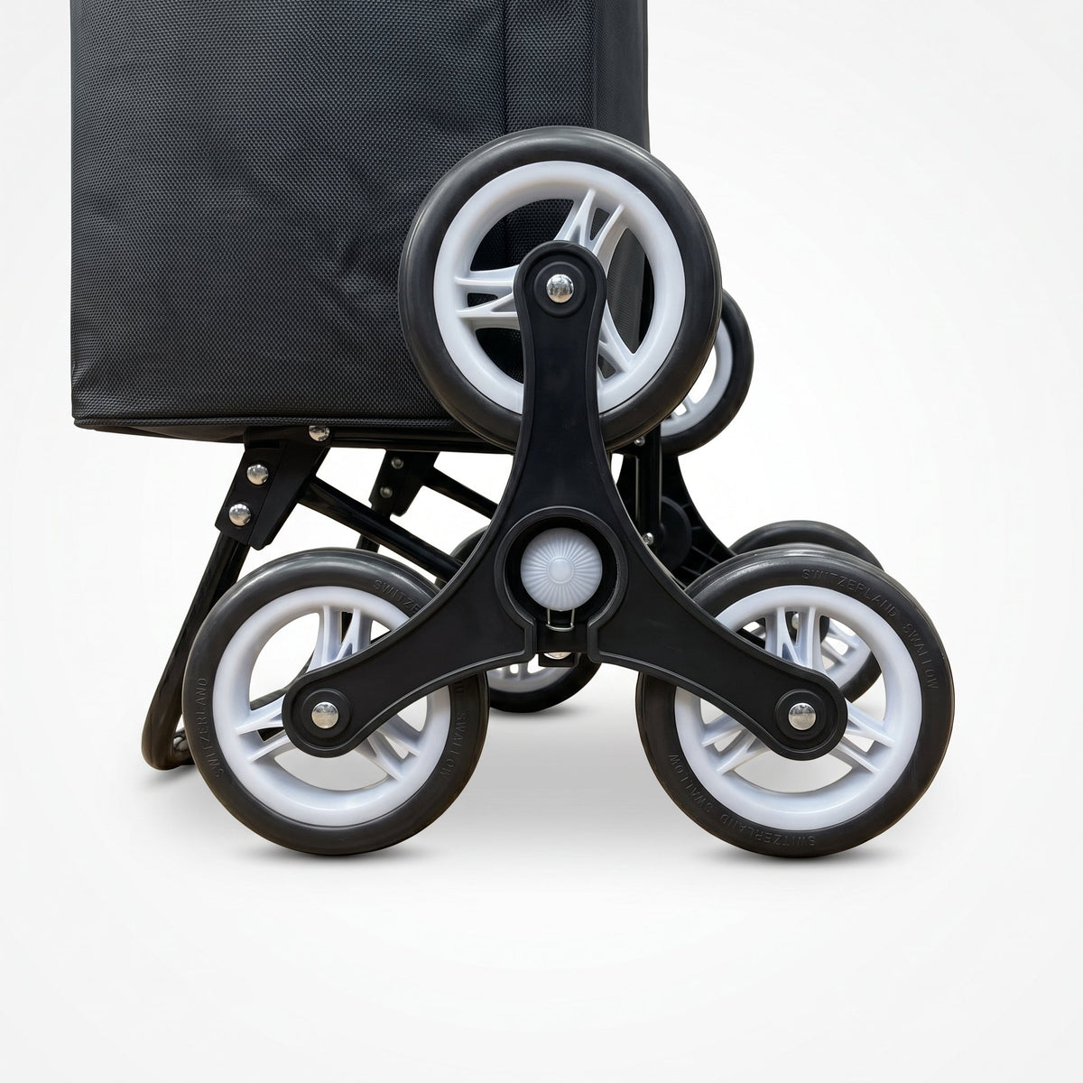 Close-up of the three wheel climbing cluster on the black Ezzyrol stair climber trolley