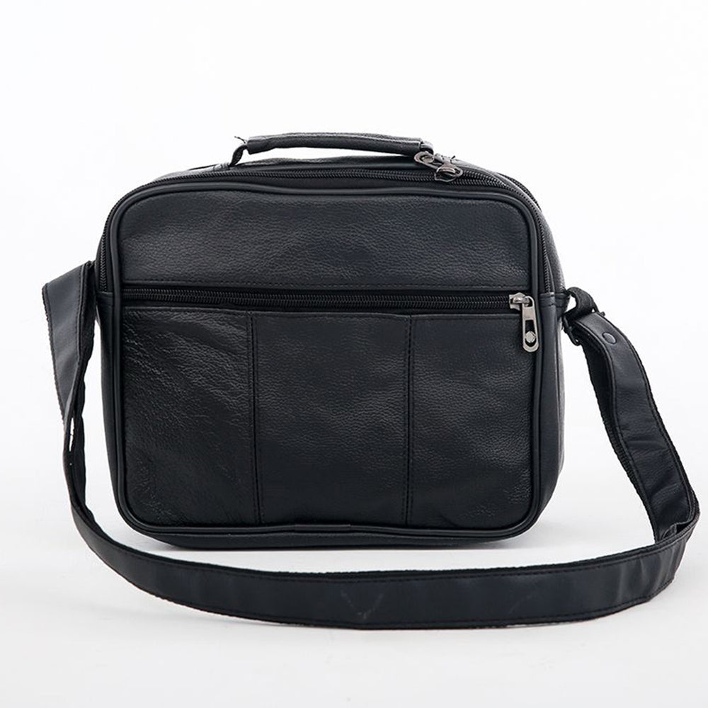 Black faux leather shoulder bag, front view with the shoulder strap laid out