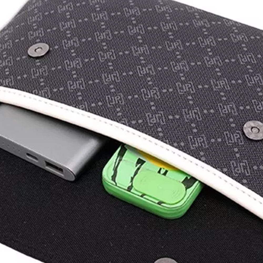 Close-up of the front flap pocket holding a power bank and a small case