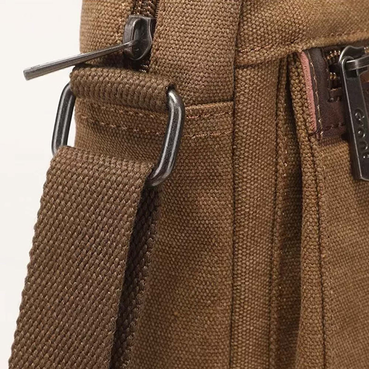 Close-up of the D ring where the shoulder strap anchors to the Grant crossbody bag