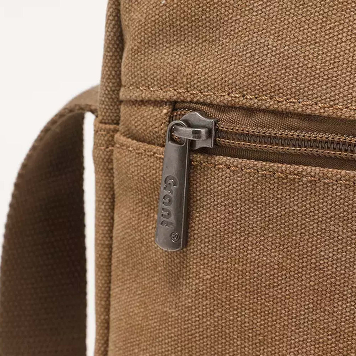 Close-up of the side zip pocket and stamped Grant zip pull