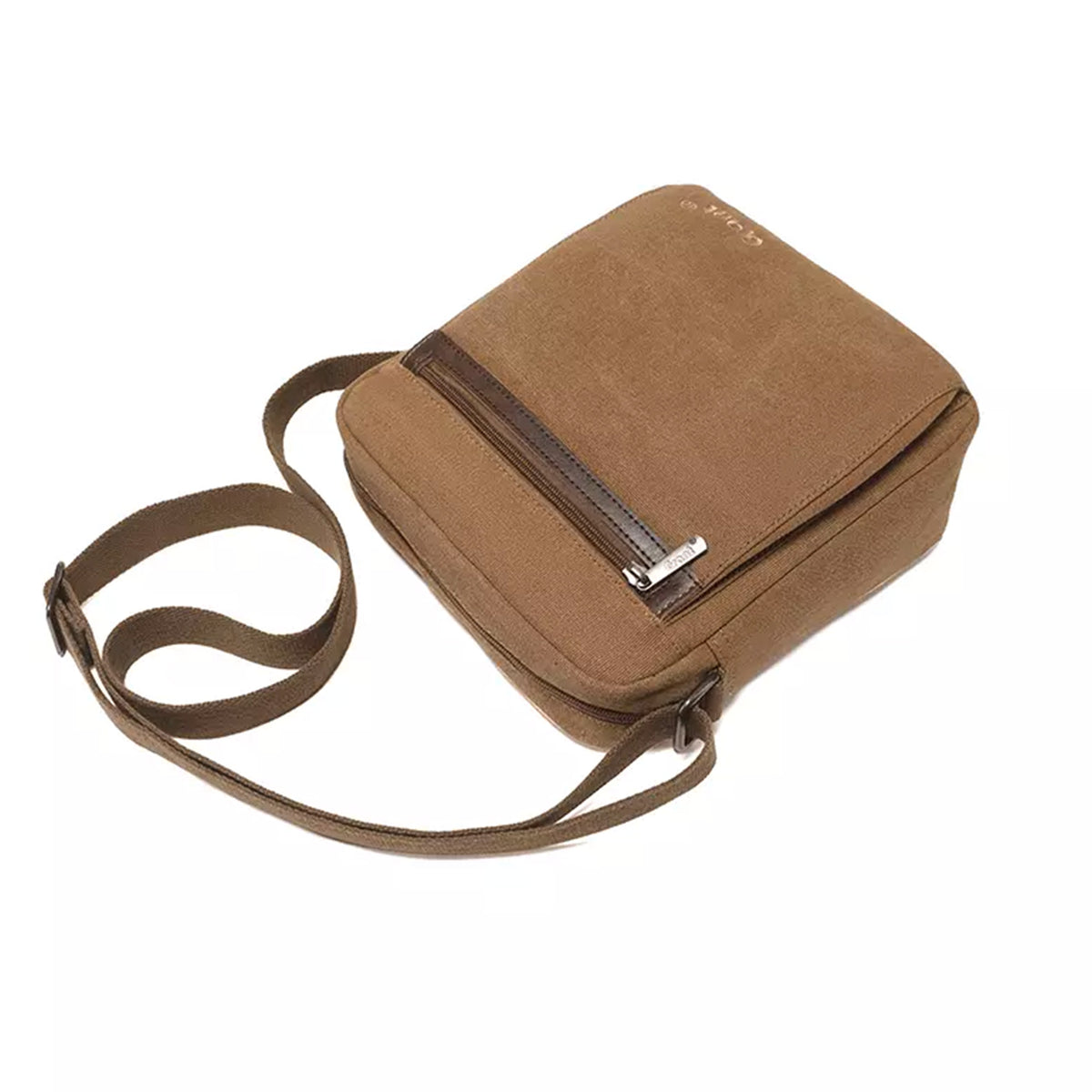 Grant compact canvas crossbody bag in tan seen from above with the strap coiled beside it