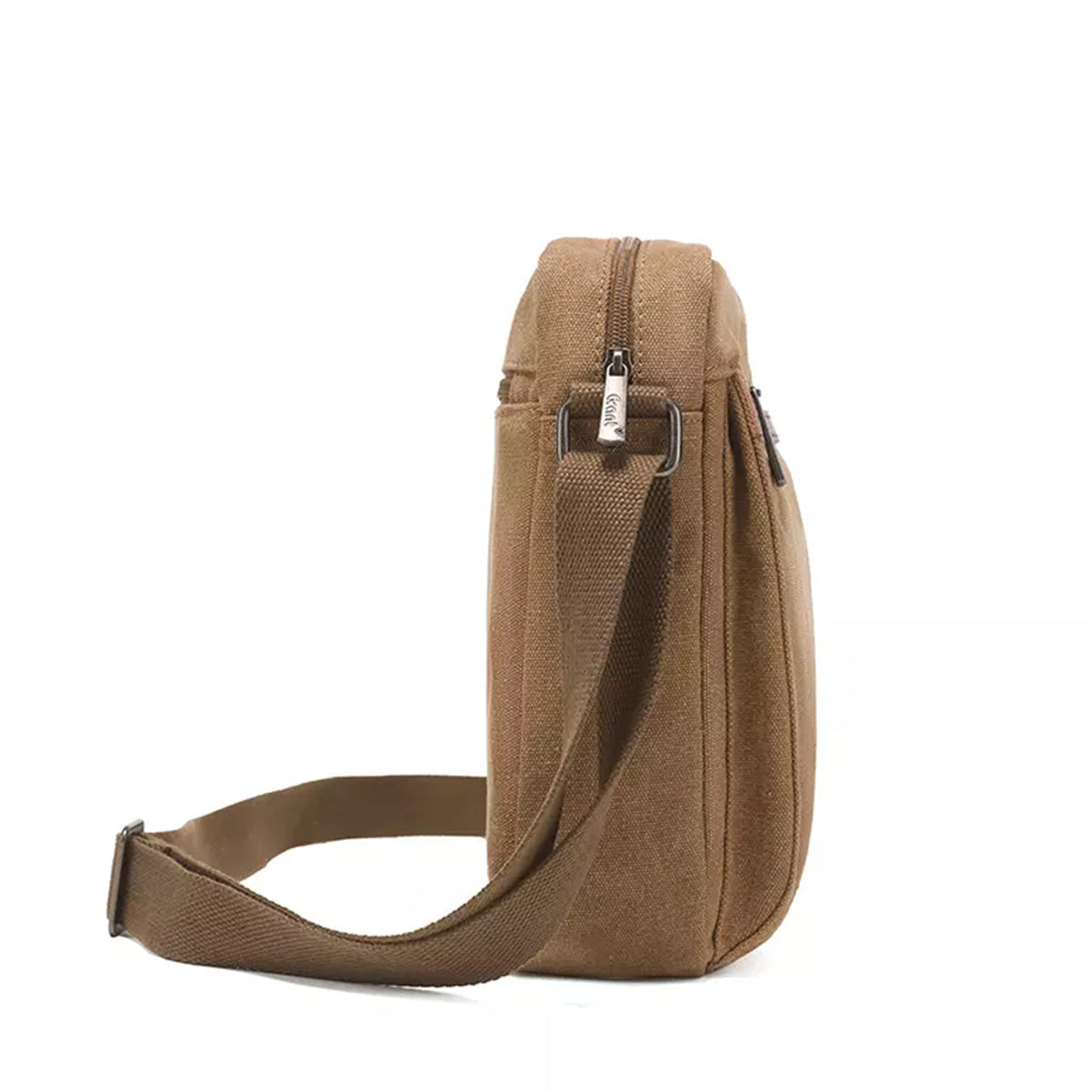 Grant compact canvas crossbody bag in tan, side profile showing its slim depth and the webbing strap