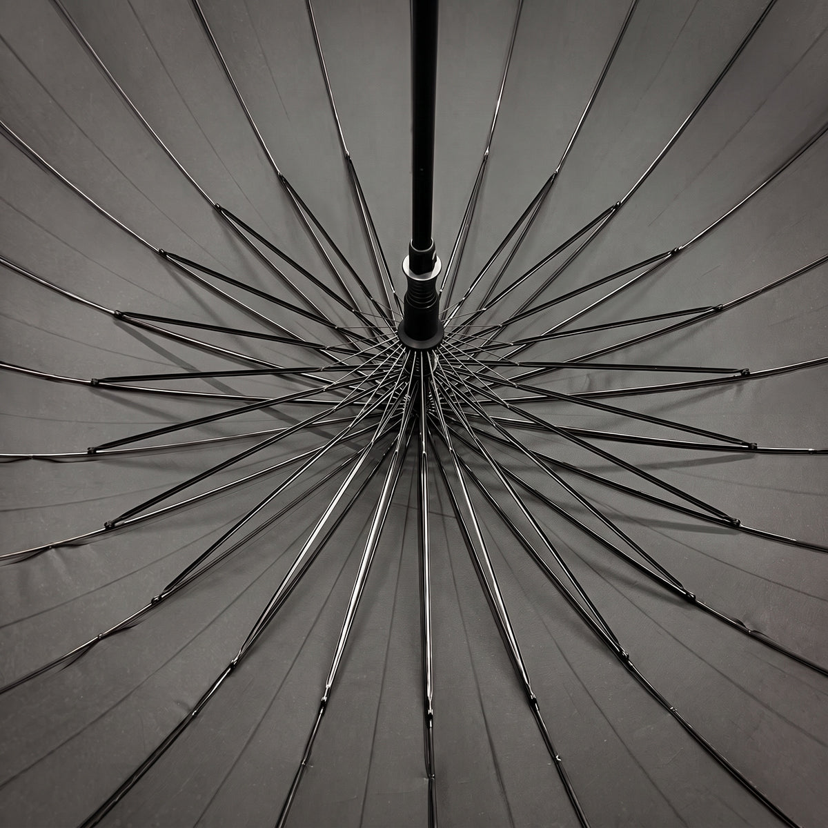 Underside of the open grey Ezzyrol Sovereign canopy, showing the 24 panel ribbed frame