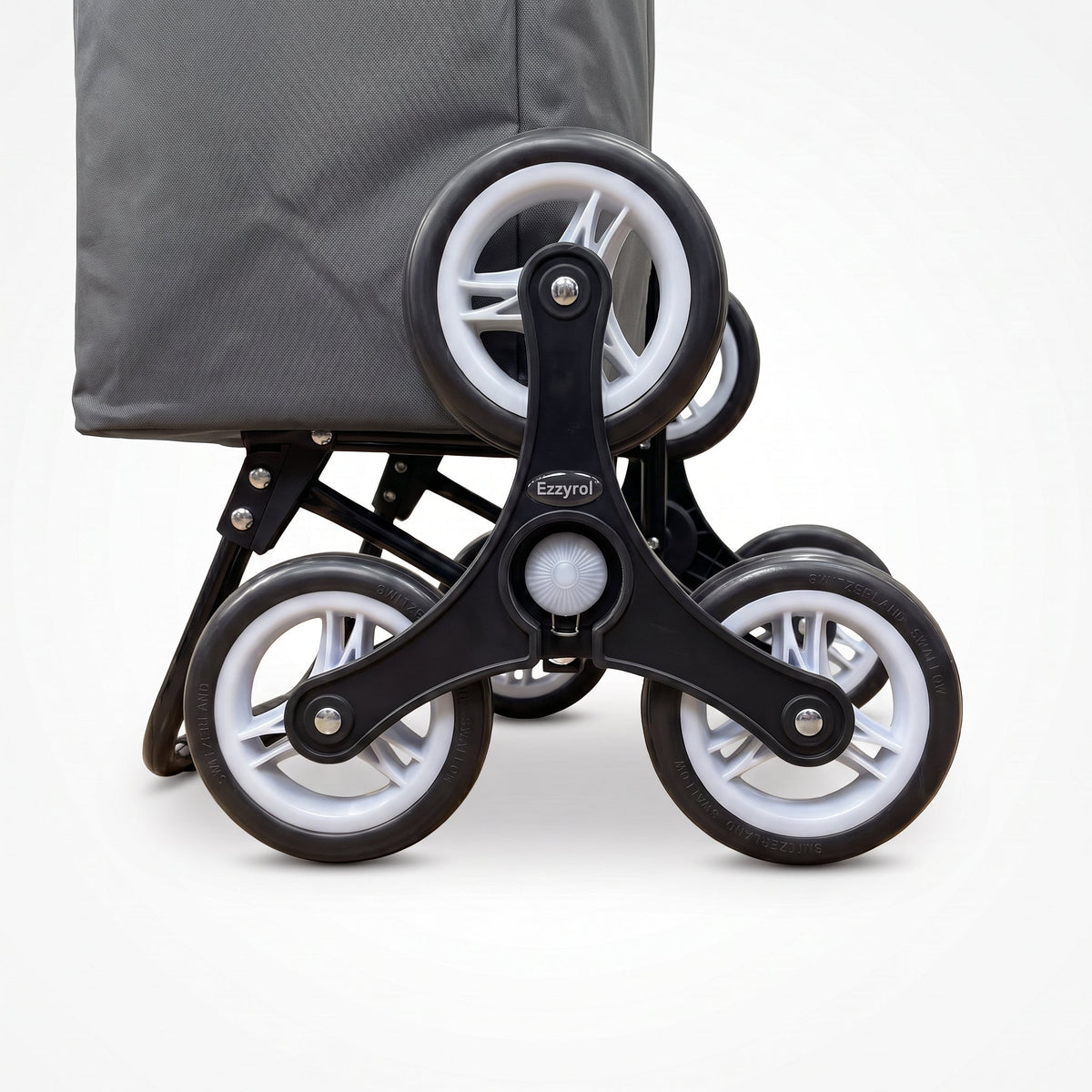 Close-up of the three wheel climbing cluster on the grey Ezzyrol stair climber trolley
