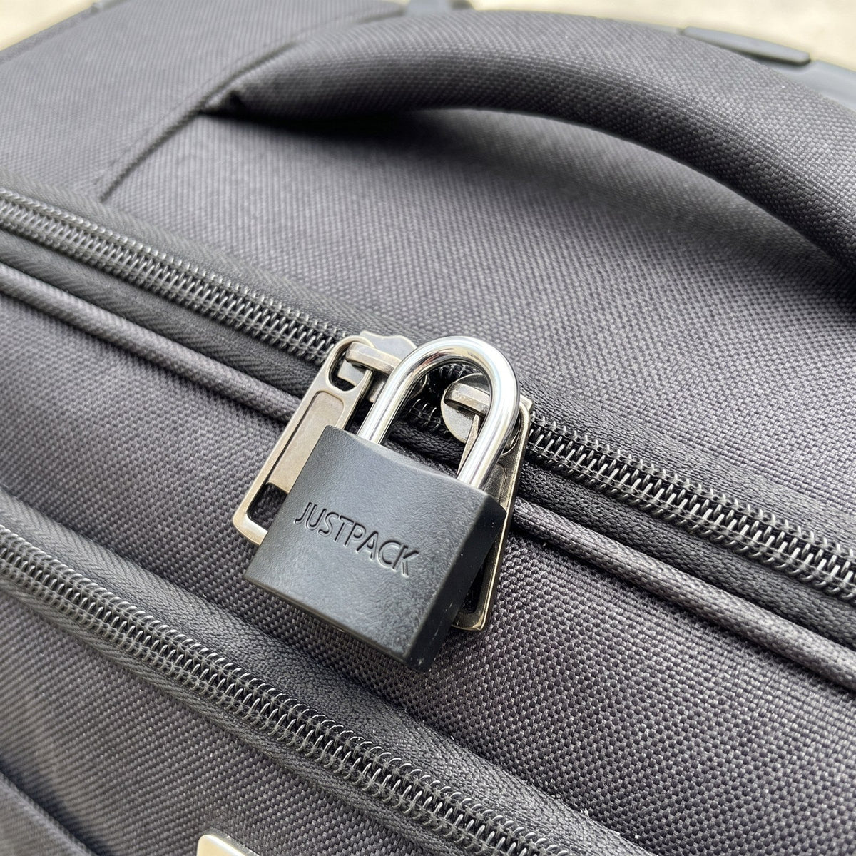 JUSTPACK Beacon keyed travel padlocks (2-pack) in black, use case on luggage zippers