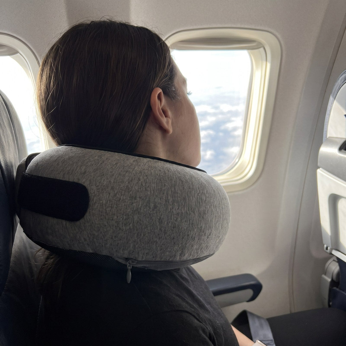 JUSTPACK Doze travel neck pillow, in use airplane seat