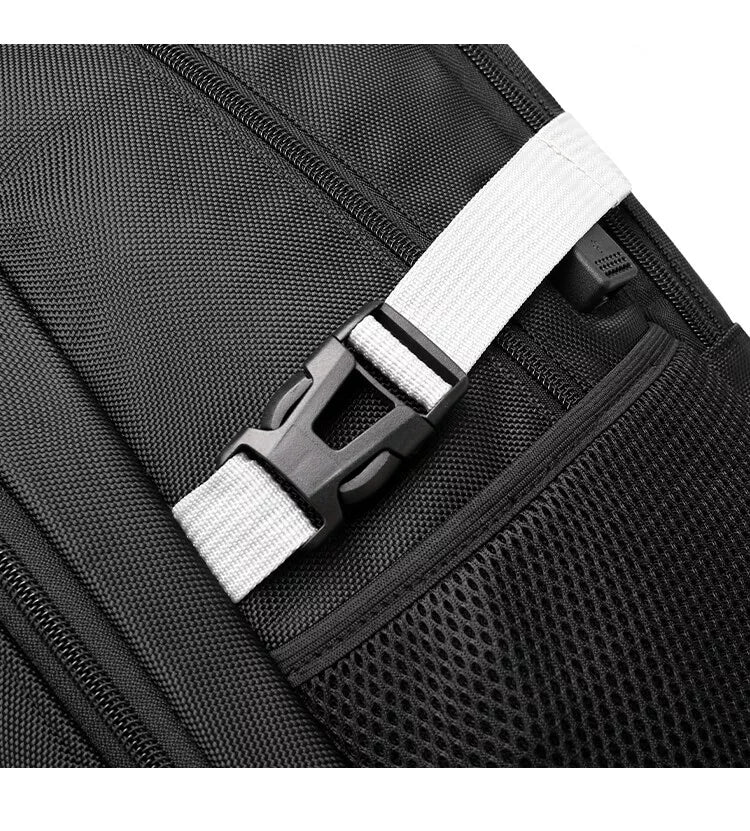 Close-up of the side mesh pocket and webbing buckle on the JustPack cabin backpack