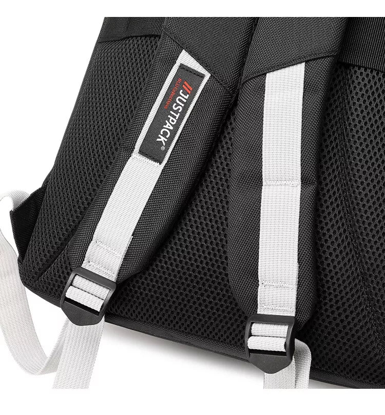 Padded mesh back panel and JustPack label on the shoulder strap